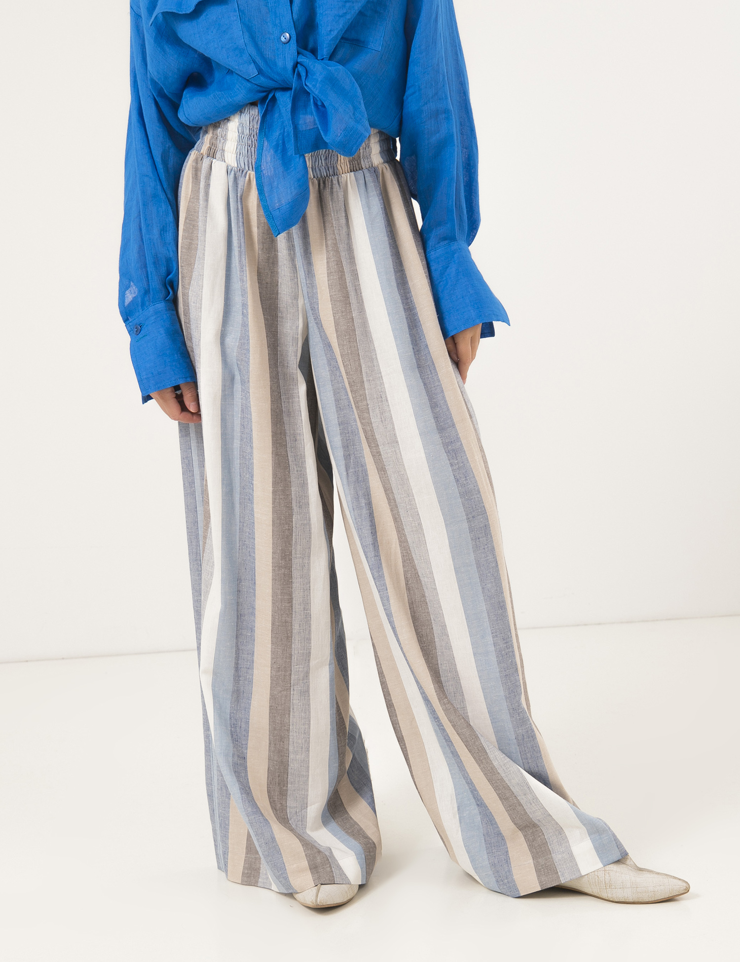Картинка Жіночі блакитні брюки в смужку