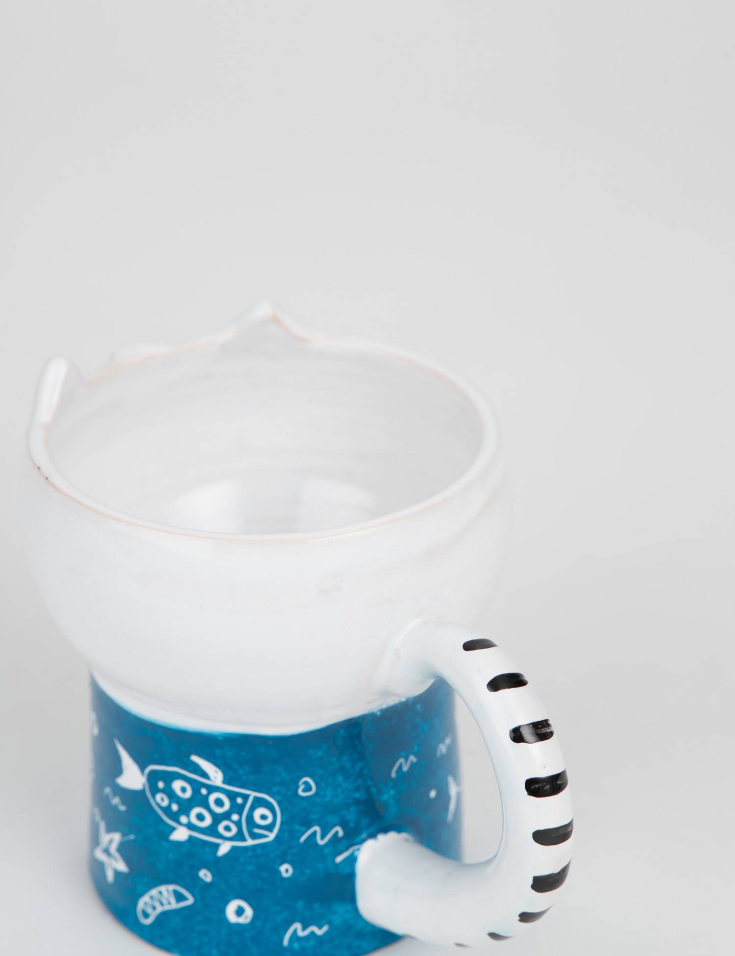 Картинка Біло-синя керамічна чашка