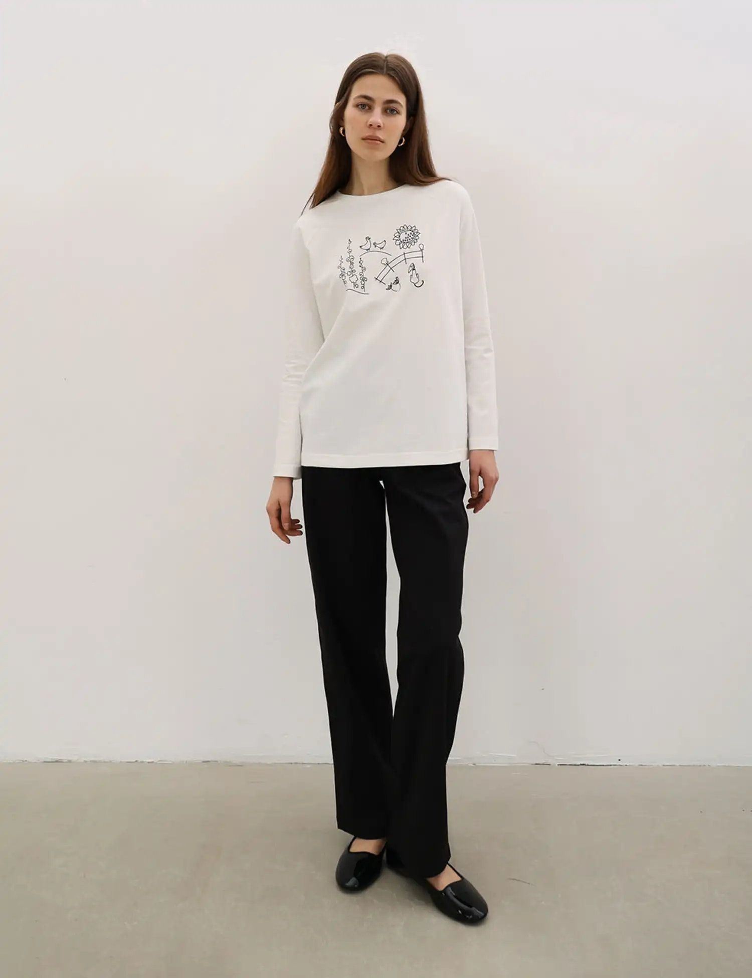 Картинка Лонгслів білий з принтом