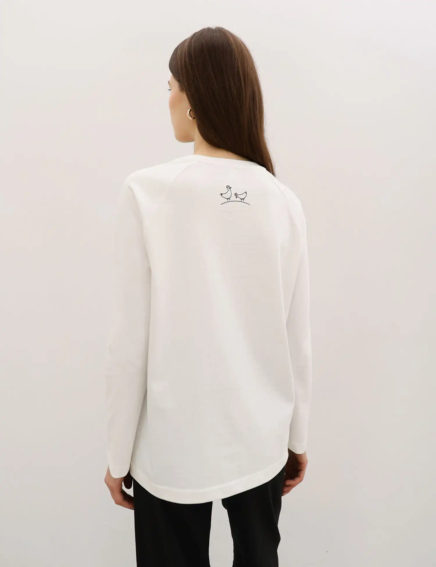 Картинка Лонгслів білий з принтом