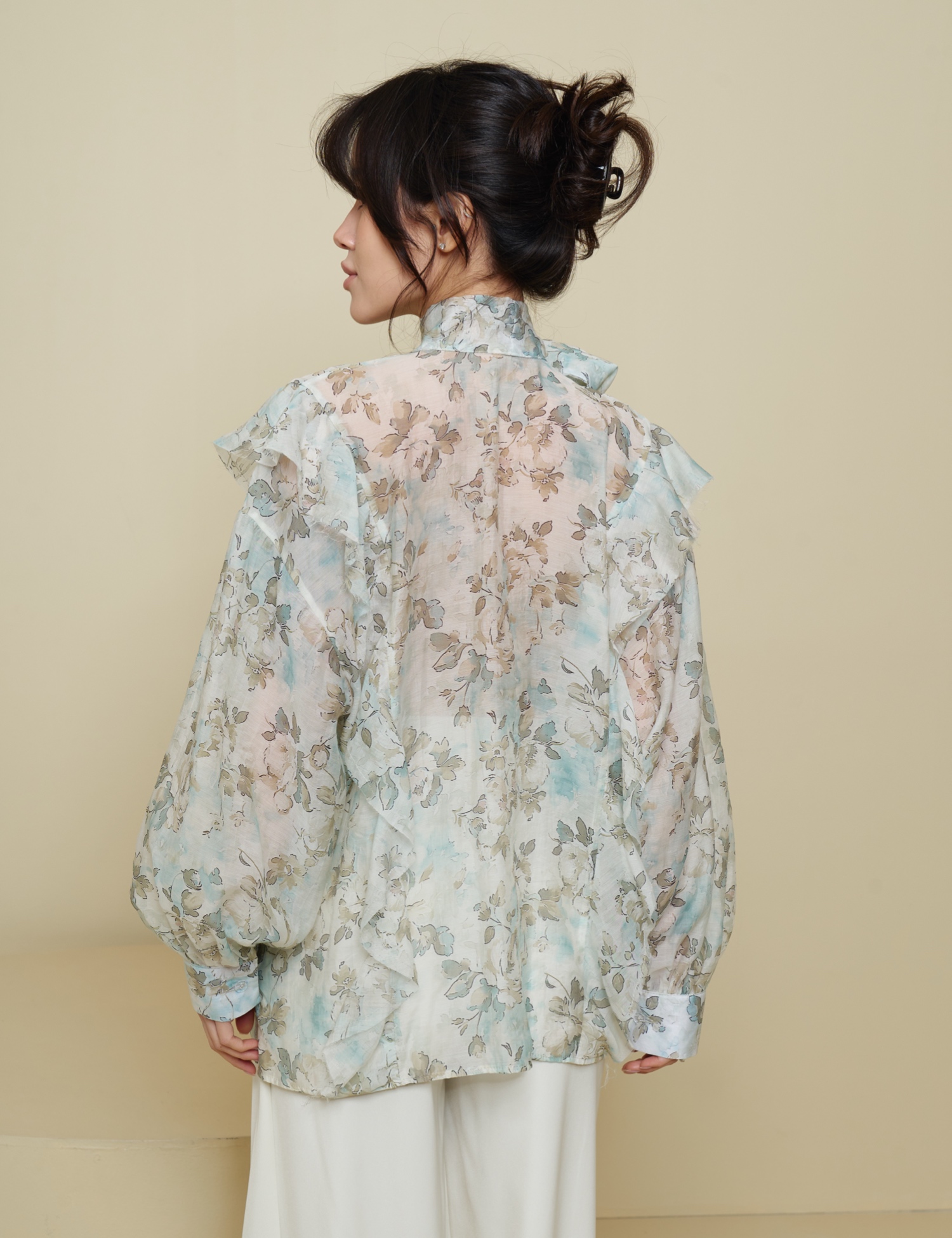 Картинка Блуза з бантом в зелену квітку