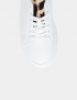 Картинка Жіночі білі шкіряні кеди з контрастними деталями