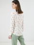 Картинка Жіноча біла блуза з квітковим візерунком