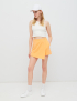 Картинка Жіночі помаранчеві асиметричні шорти