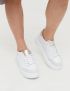 Картинка Жіночі білі шкіряні кросівки