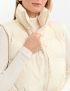 Жилет з високим коміром молочний Картинка Жилет з високим коміром молочний