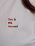 Картинка Лонгслів "Live in the moment" білий