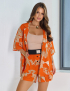 Картинка Костюм помаранчевий з принтом 