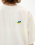 Картинка Футболка бежева з принтом 