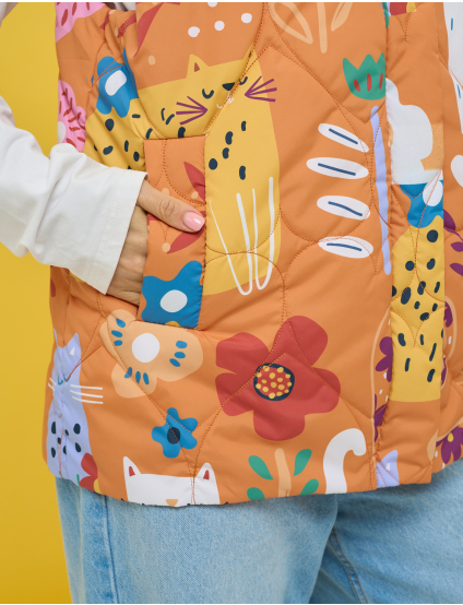 Картинка Утеплена стьобана жилетка у теплій помаранчево‑теракотовій гамі 